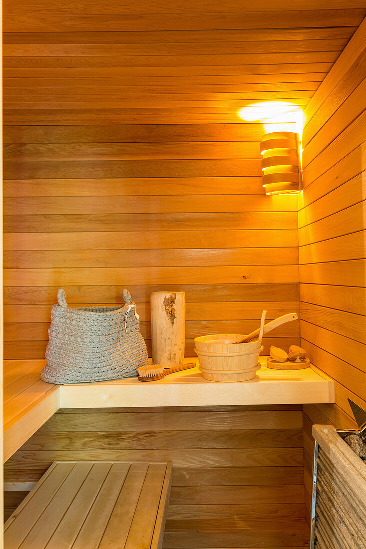 Basket, wooden bucket and other accessories in sauna