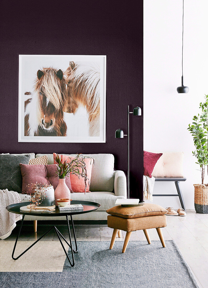 Feminine living room with horse picture on purple wall