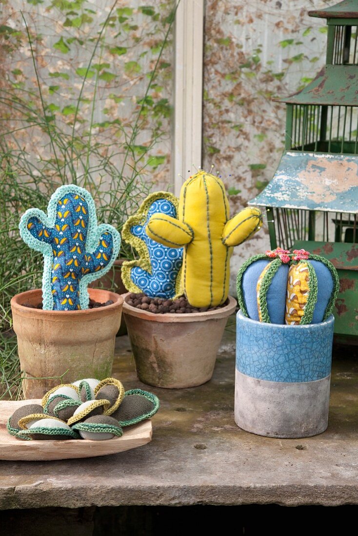 Various hand-sewn cacti and succulents with crocheted spines