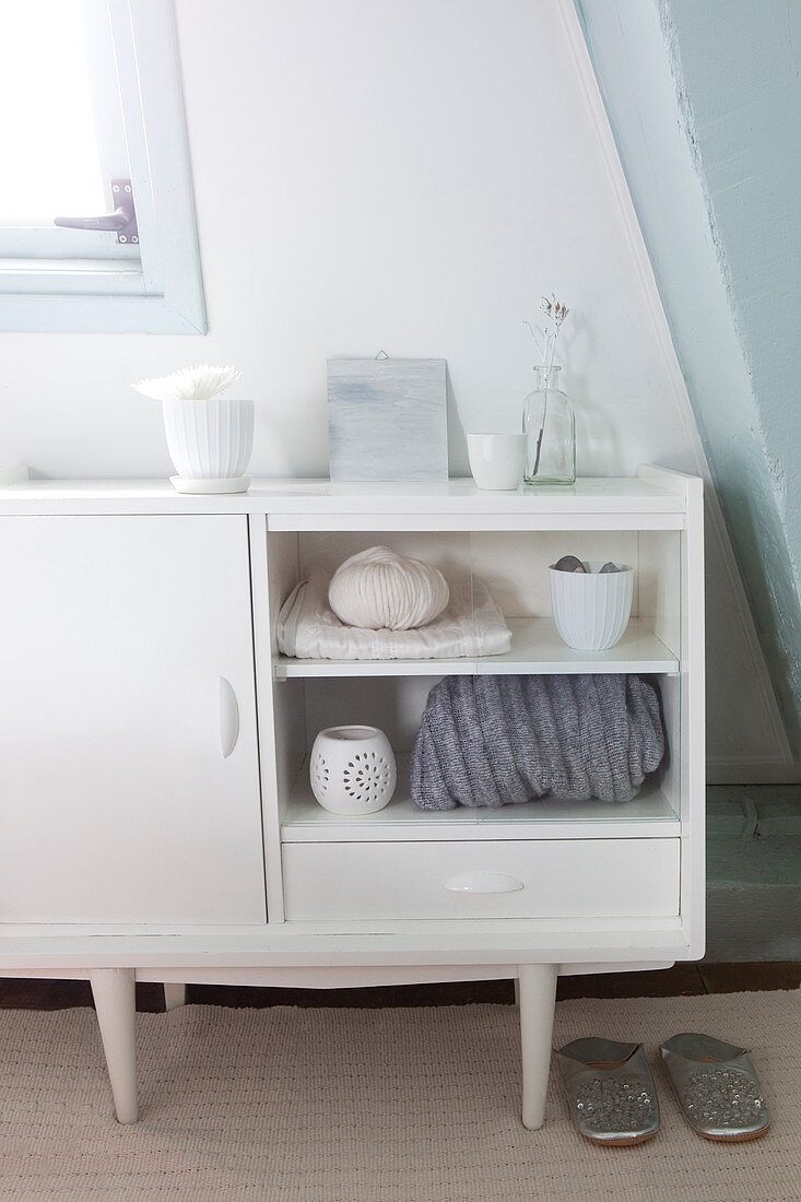 White sideboard in bedroom