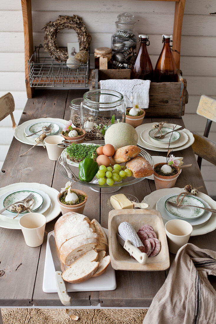 Rustic, wooden, country-house table set for Easter breakfast