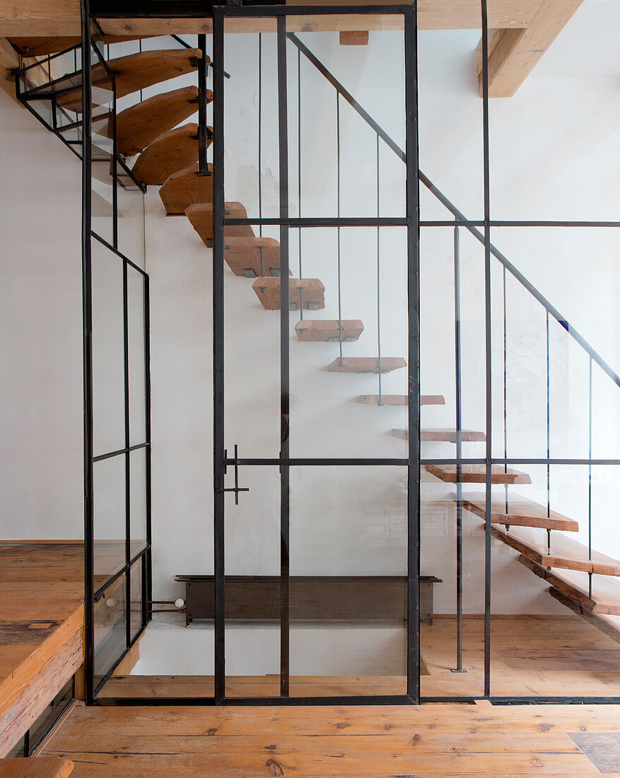Staircase behind glass wall