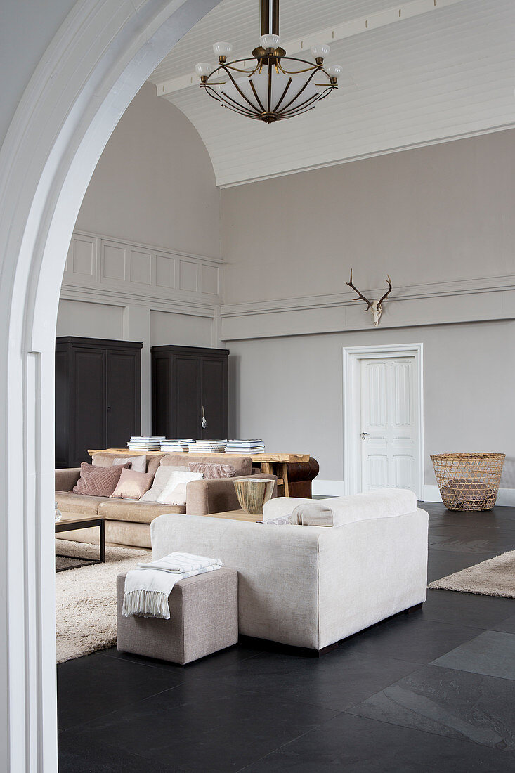 Living room in muted shades in converted church nave