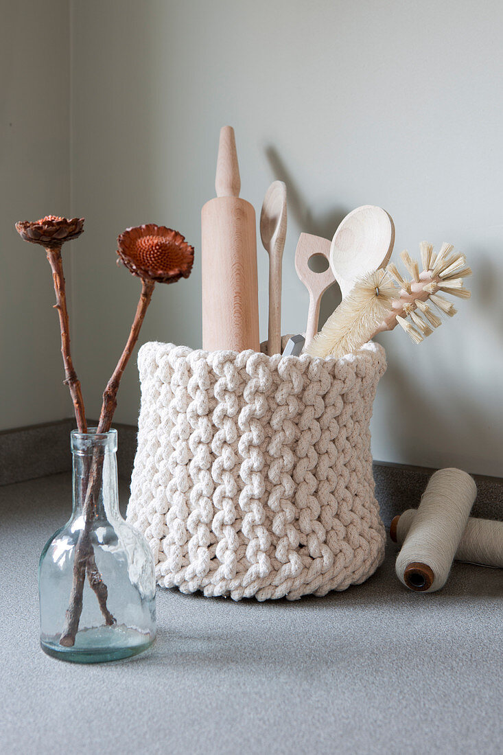 Kitchen utensils in knitted basket