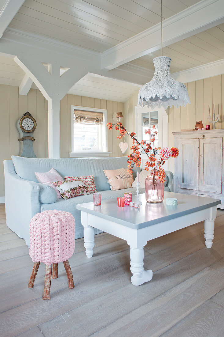 Rural living room in white, gray, and beige with romantic pink accents