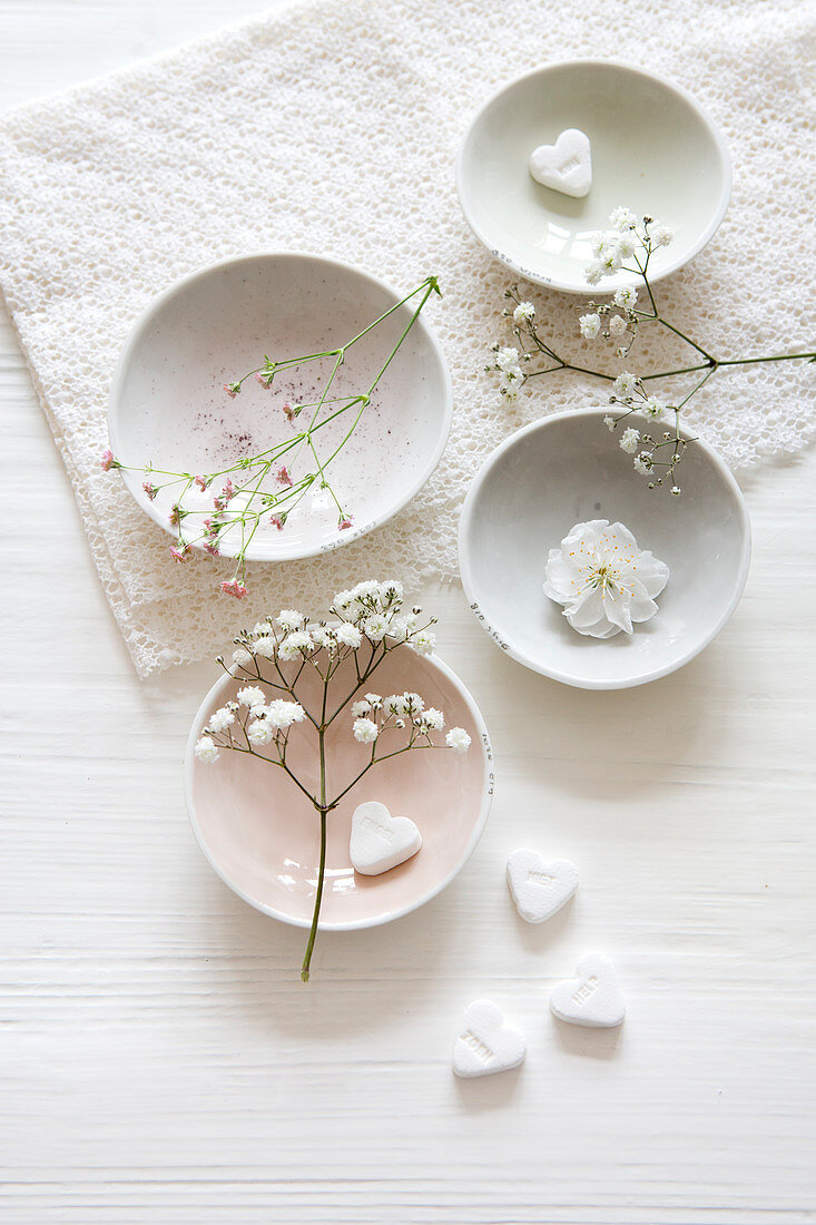 White bowls with gypsophila and hearts