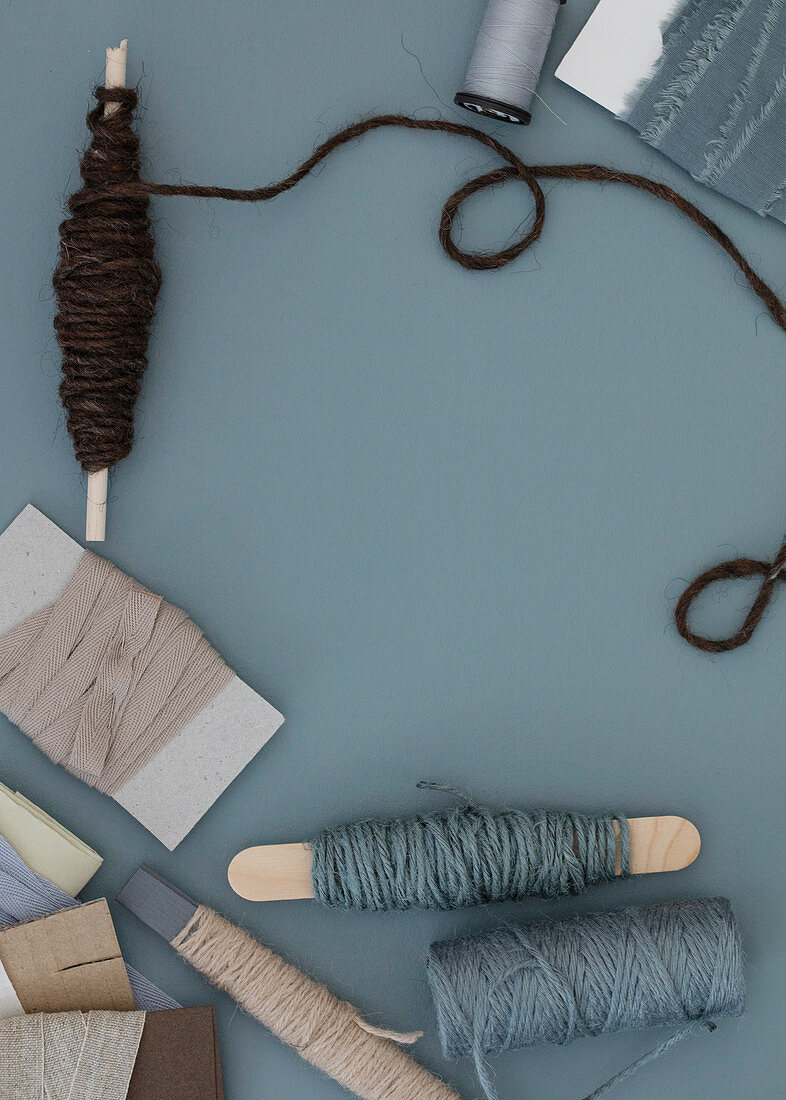 Cord and fabric ribbons in blue-gray and natural tones