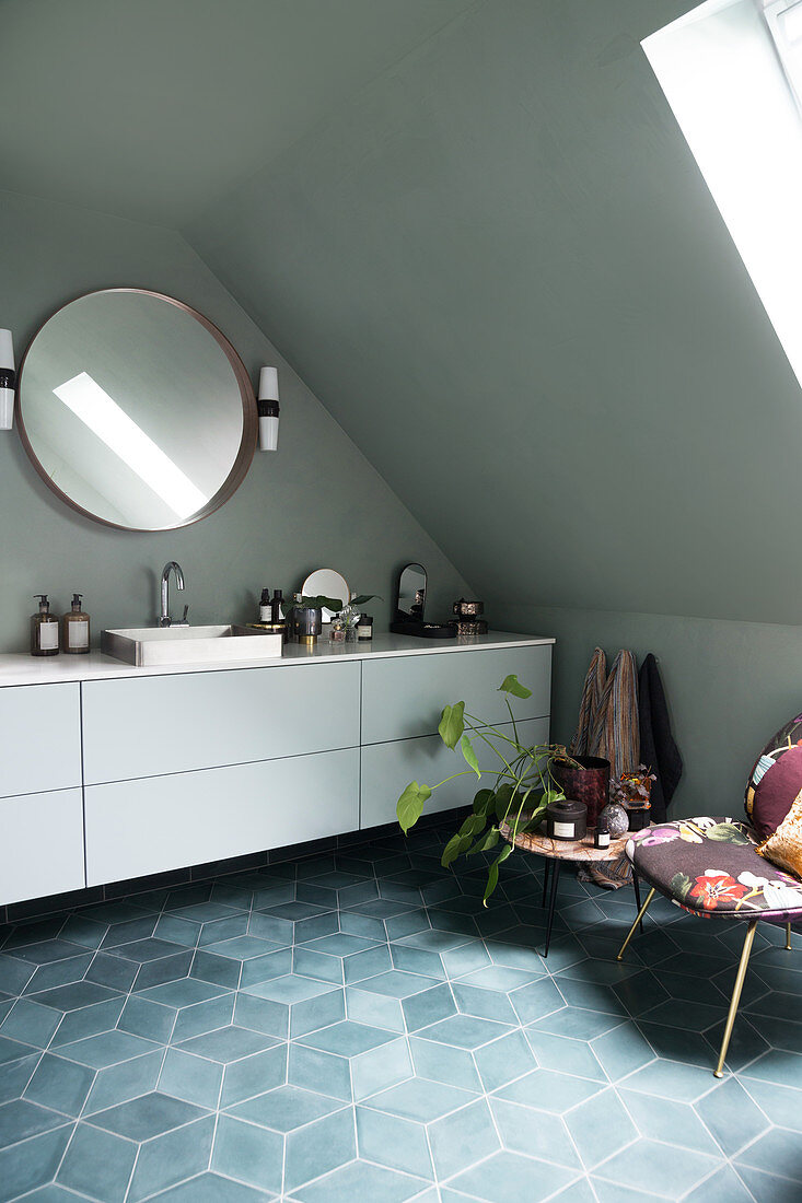 A long white vanity unit in an attic bathroom