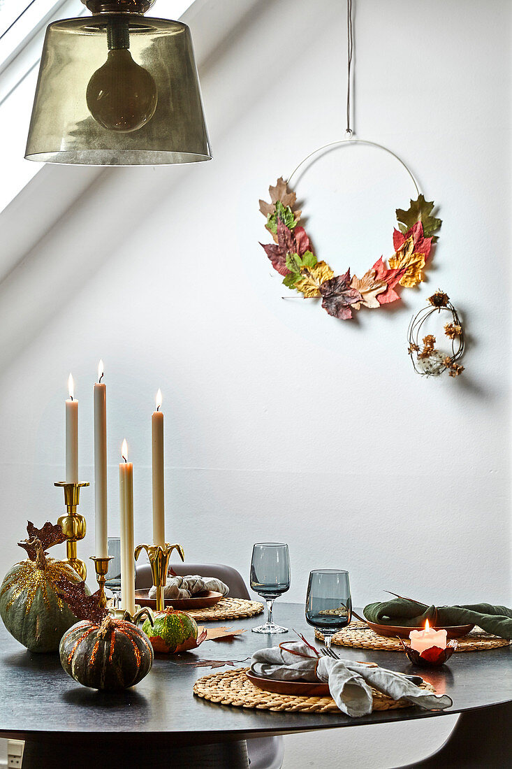 A table laid with autumn decorations