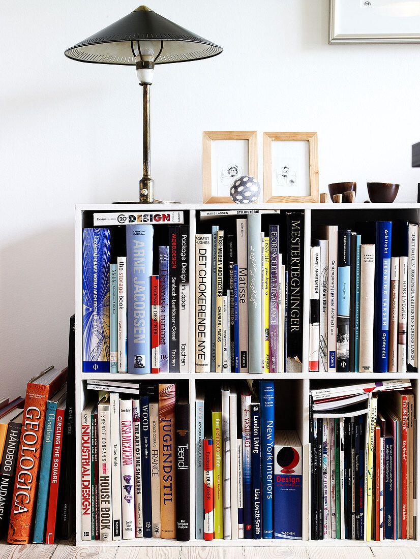 A table lamp on a bookcase