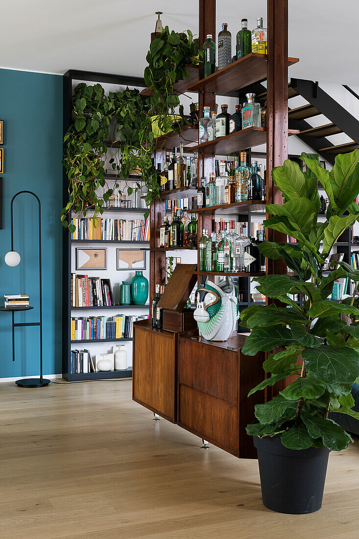 Retro shelving combination used as bar and partition in living room