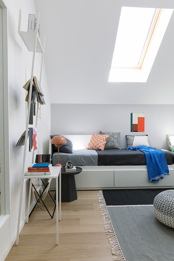 Couch against knee wall in modern attic living room