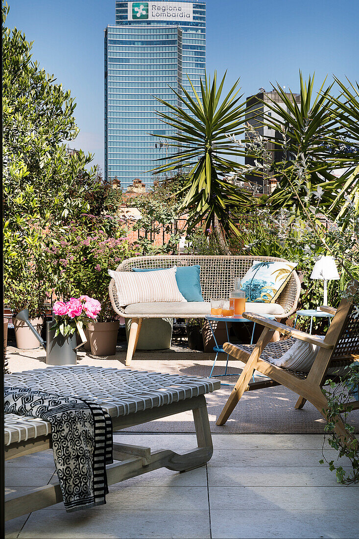 Lounge area on summery, urban roof terrace