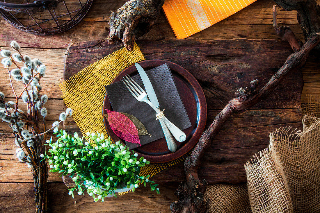 Spring table setting - cutlery on wood