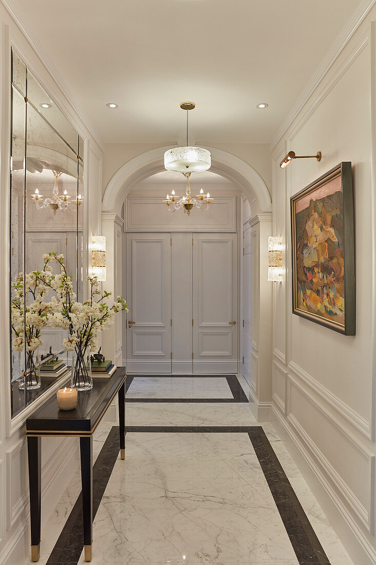 Luxurious hallway with marble floor and panelled walls