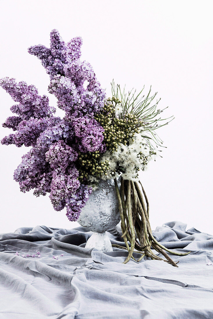 Bouquet of lilac with fruits of the trumpet tree