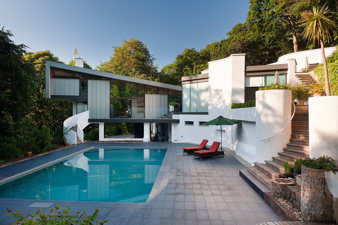 60s-style, architect-designed house with cantilever extension, monopitch roof and pool