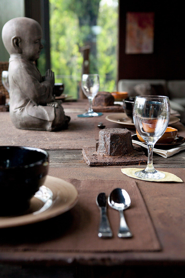 Rustic table in brown tones with Buddha