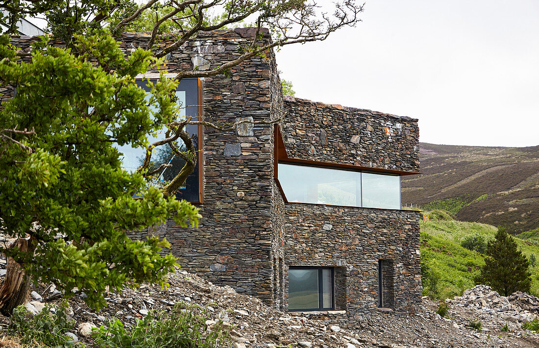Modern architect-designed house integrated into landscape