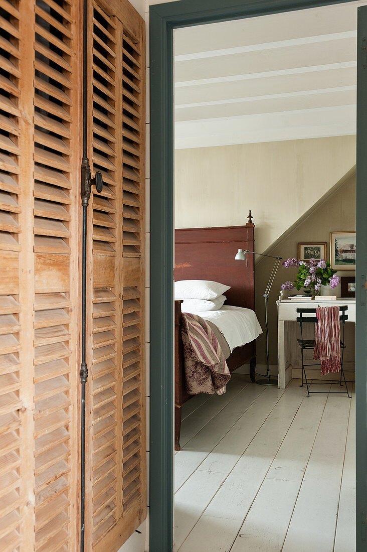 Louvered wooden storage cupboards provide generous space