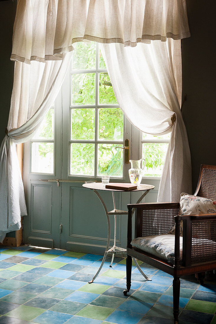 Curtains on classic panelled doors with lattice windows