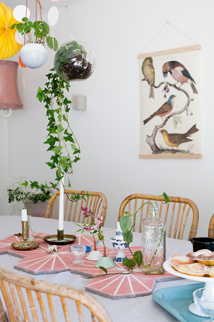 Pink hexagonal tiles and vintage-style ornaments on table