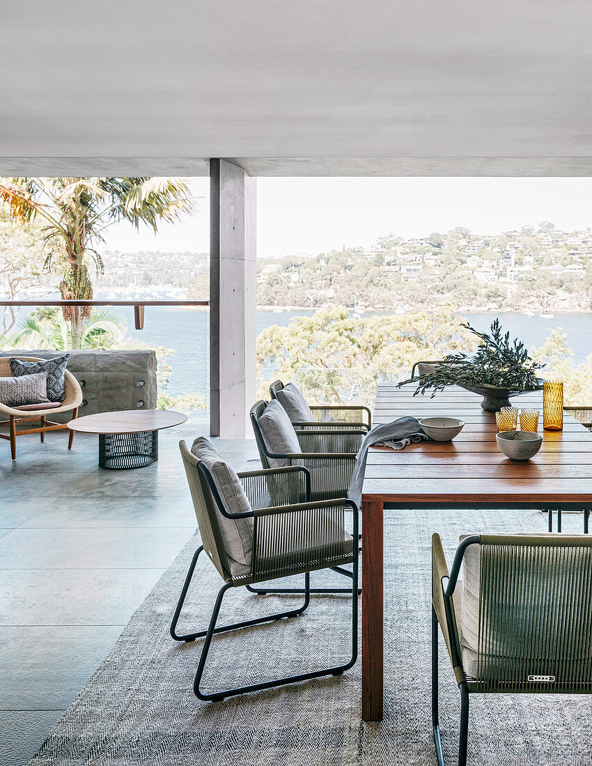 Dining room in natural tones in the architect's house with panoramic views