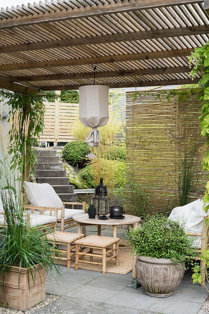 Bamboo furniture on Oriental-style roofed terrace