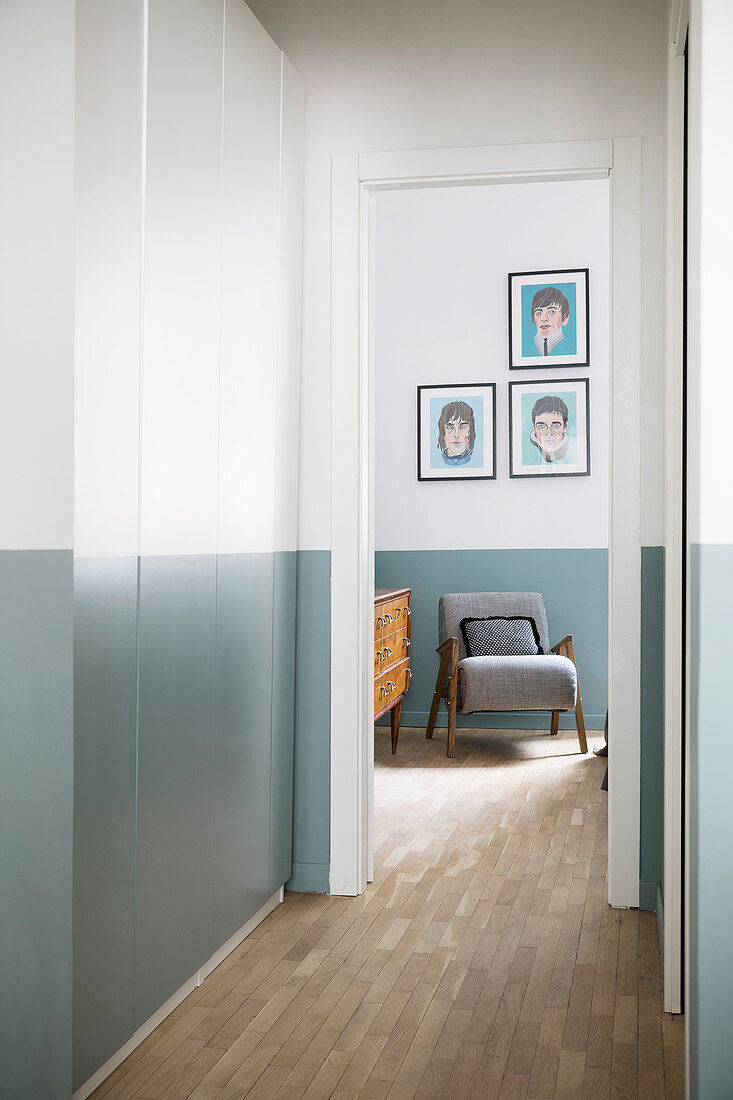 Fitted cupboards in hallway with two-tone walls