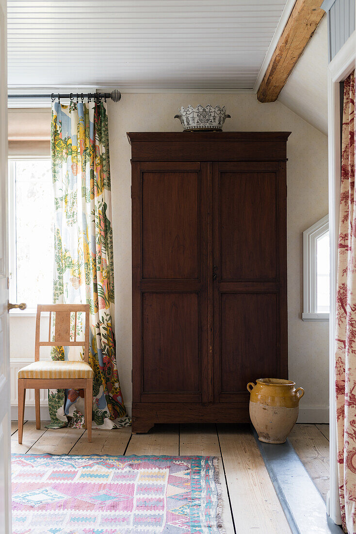 Old wooden cupboard in interior of renovated Swedish house