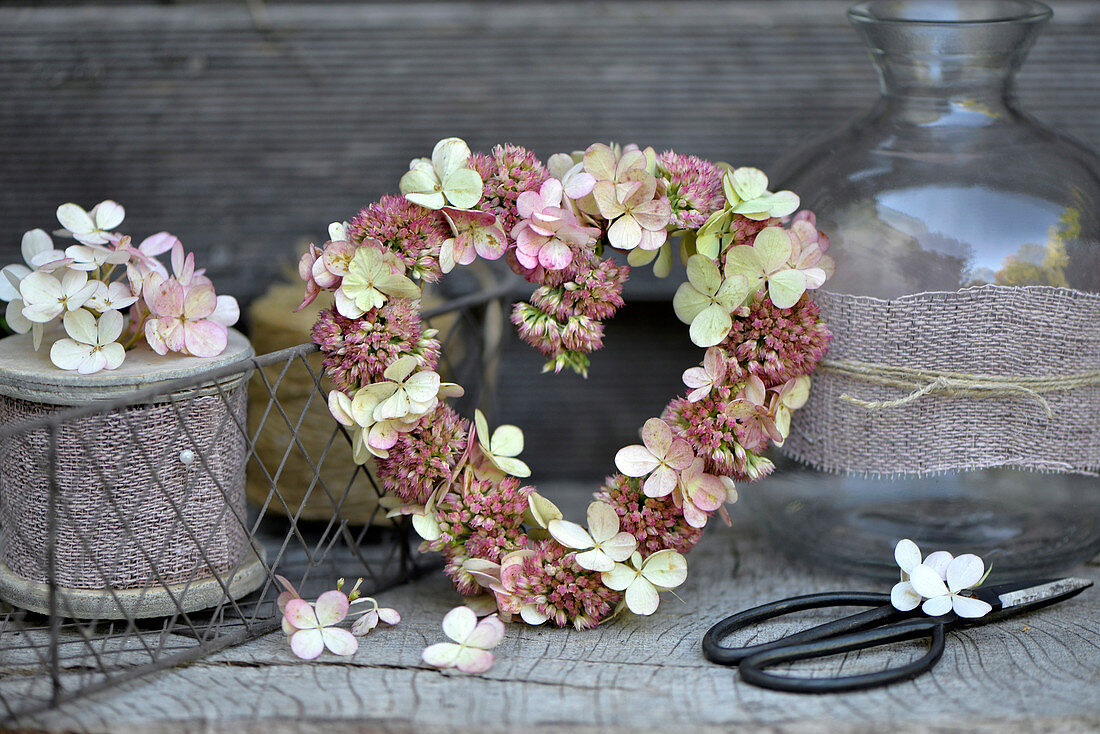 Heart-shaped wreath of sedum and hydrangea florets