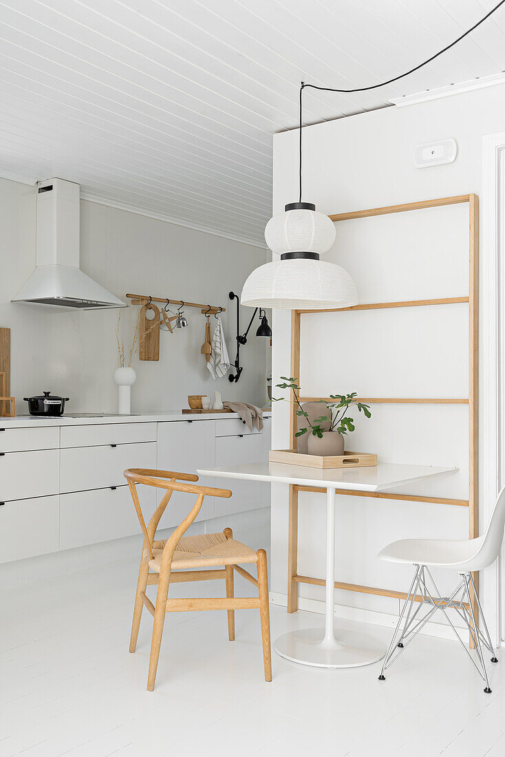 Various wooden elements in white Scandinavian kitchen