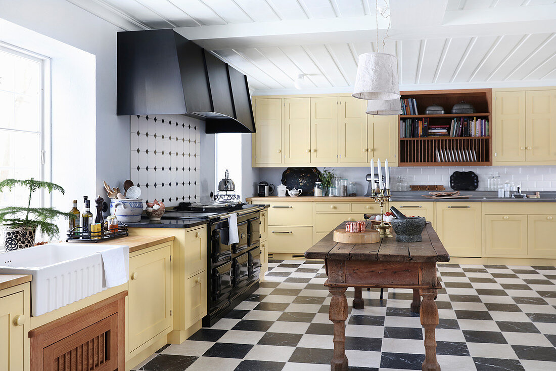 Large, country-house kitchen-dining room with chequered floor