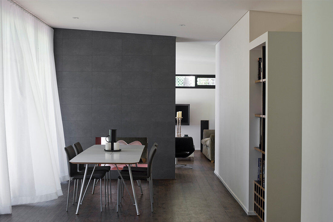 Modern, open-plan interior in shades of grey