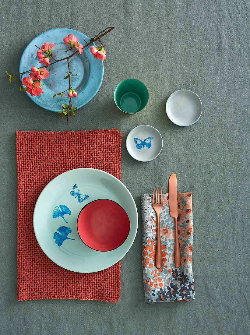 Oriental-style place setting with printed crockery