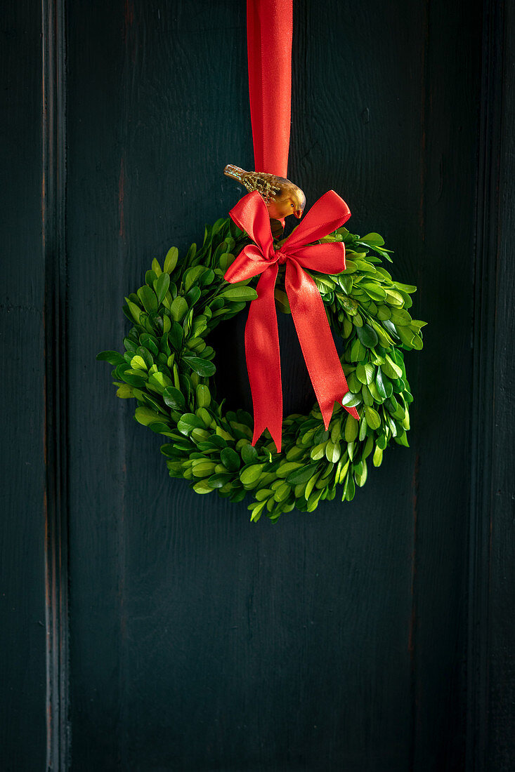 Christmas wreath of box leaves with red bow