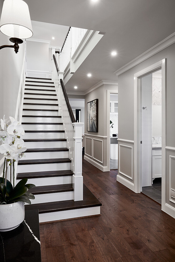 Classic hallway with stairs and panelled walls