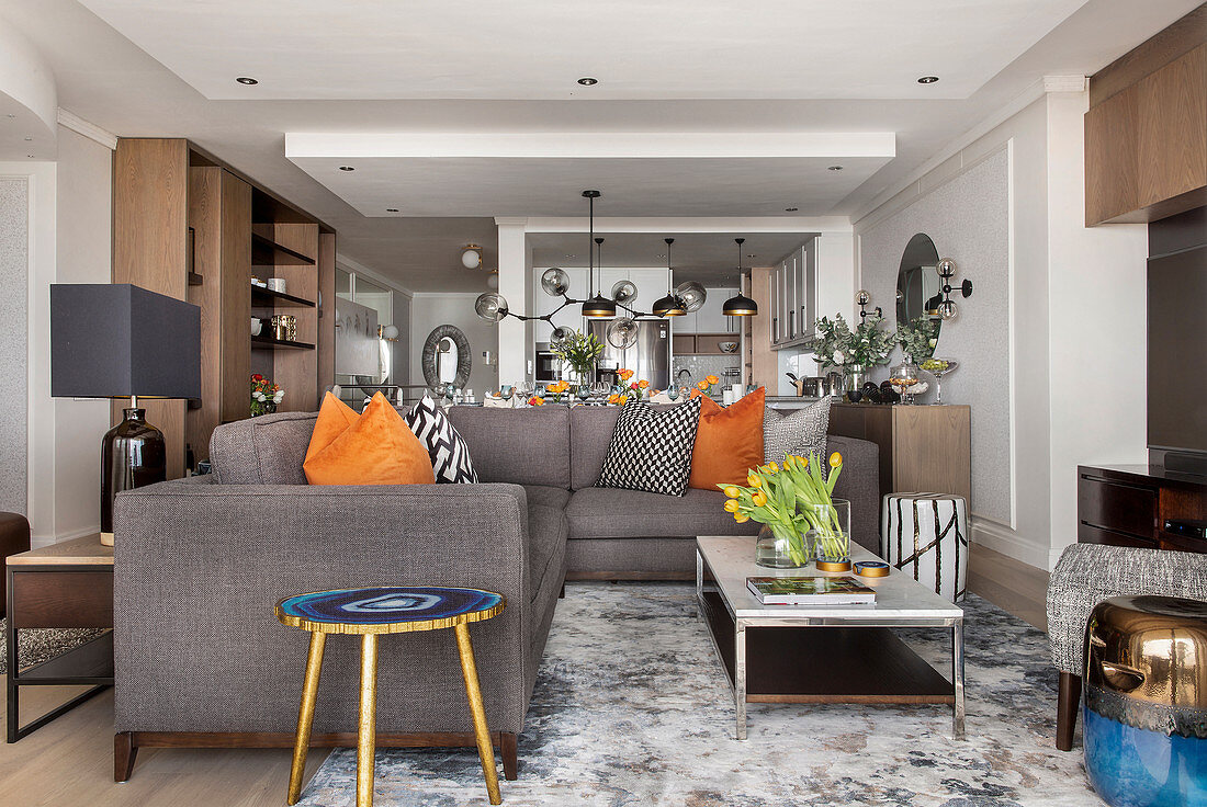 Grey sofa and coffee table in open-plan interior