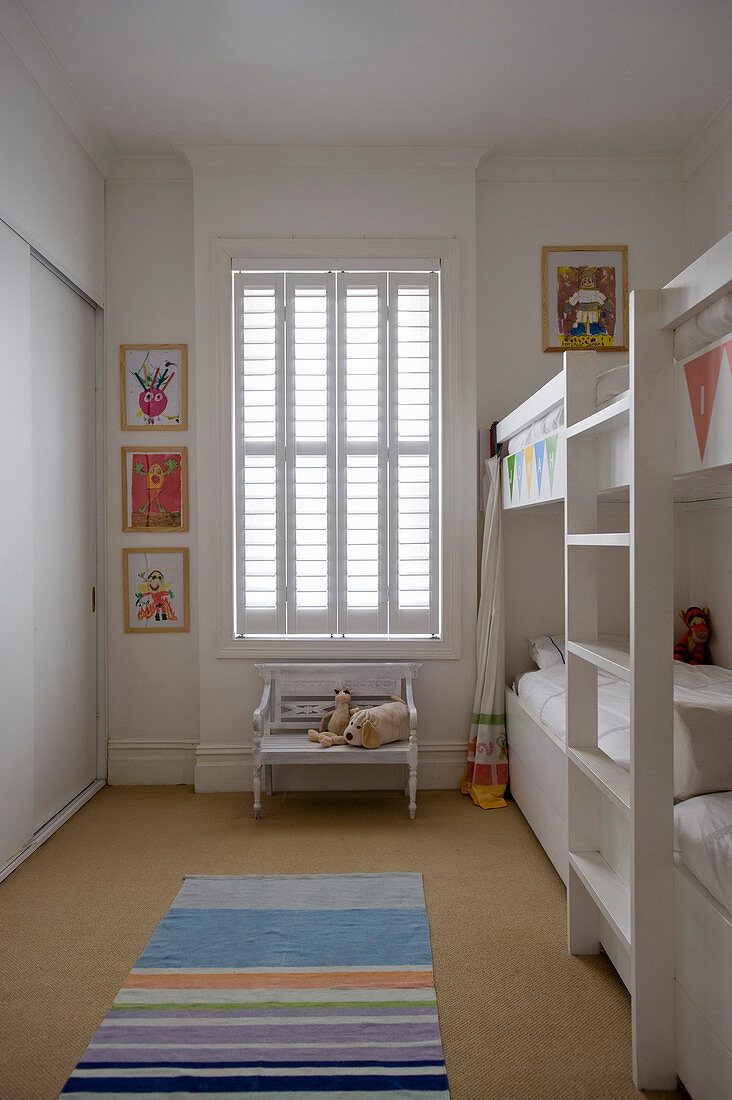 White bunk beds in children's bedroom