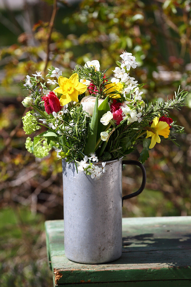 Natural spring bouquet in old metal jug