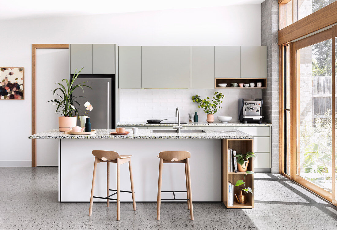 Modern open kitchen in Scandinavian style with garden access