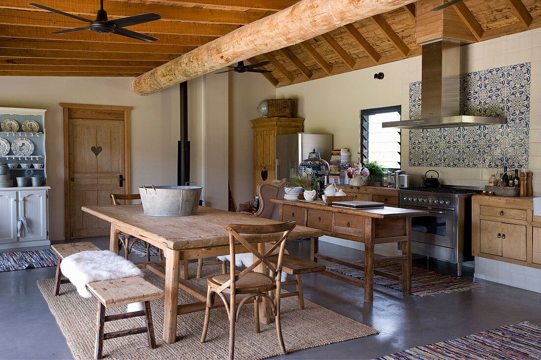 Wooden furniture in rustic kitchen-dining room