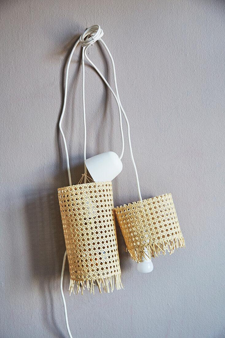 Pendant lamps with lampshades handmade from woven cane