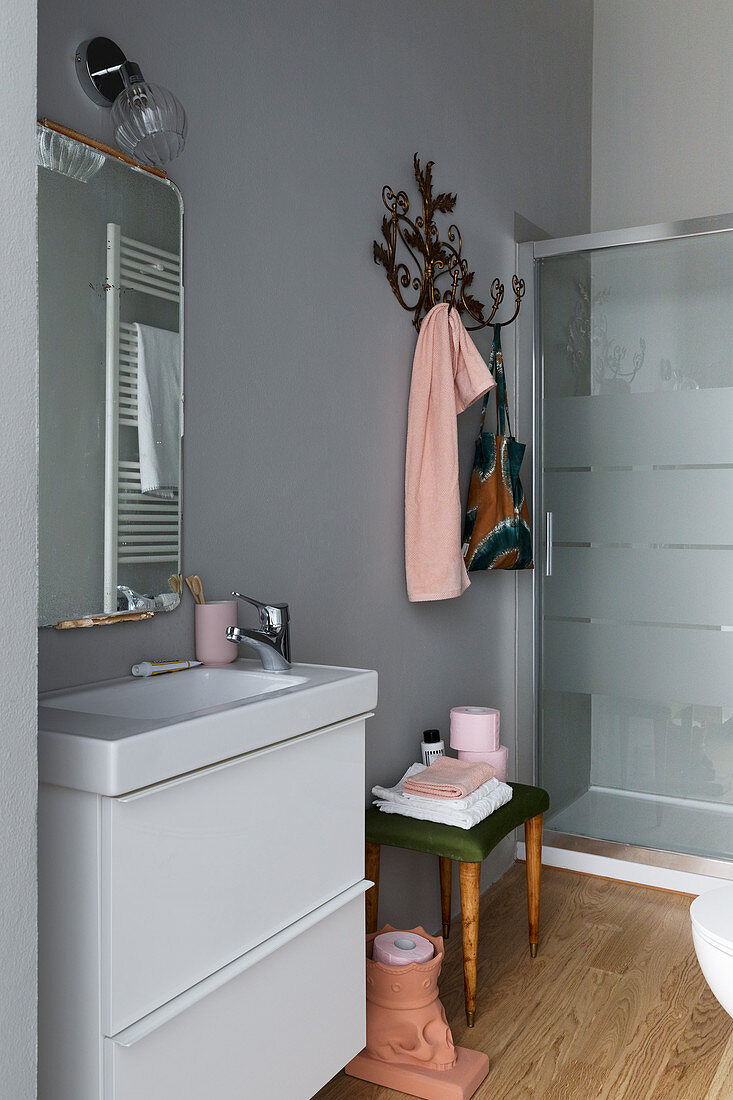 Pale grey bathroom with pink accents