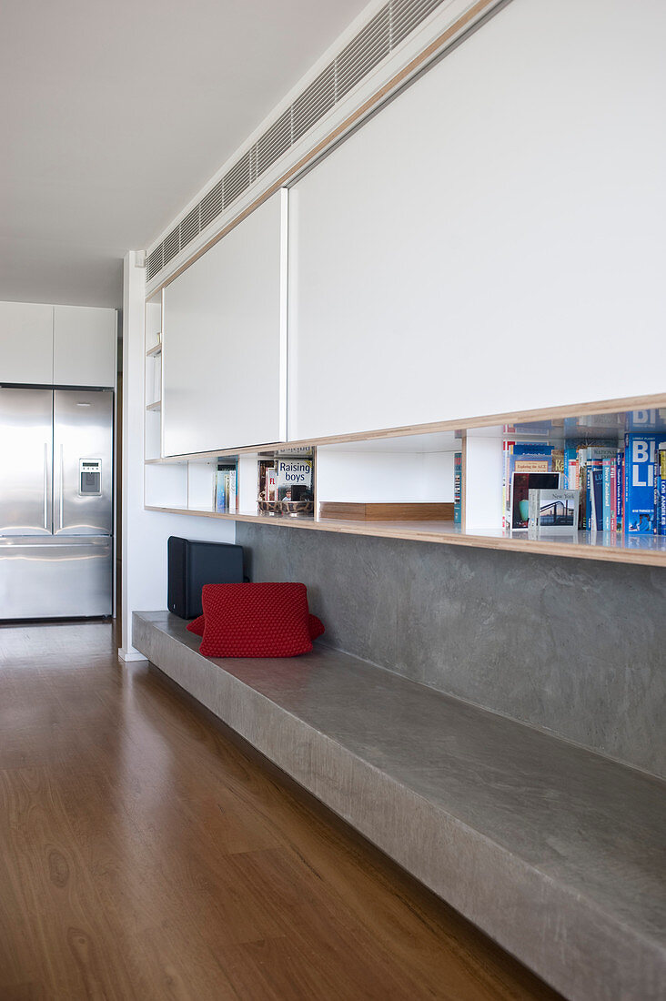 Living room cabinets with bookshelf and concrete bench