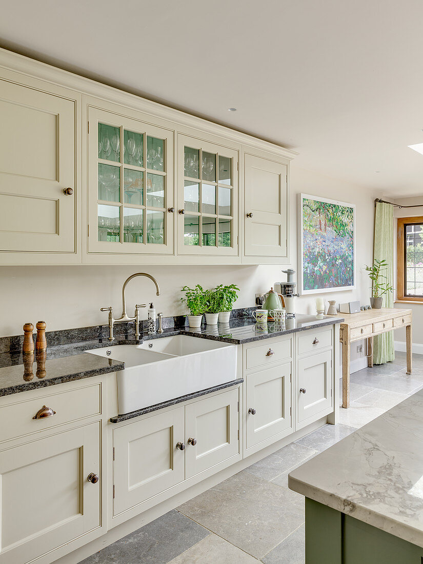 Cream country-house kitchen with black marble worktops
