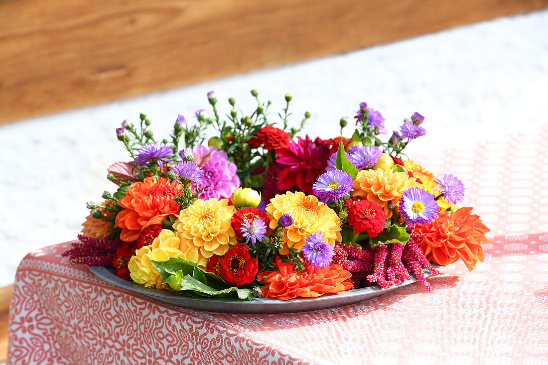 Late-summer wreath of dahlias, zinnias, asters and amaranthus