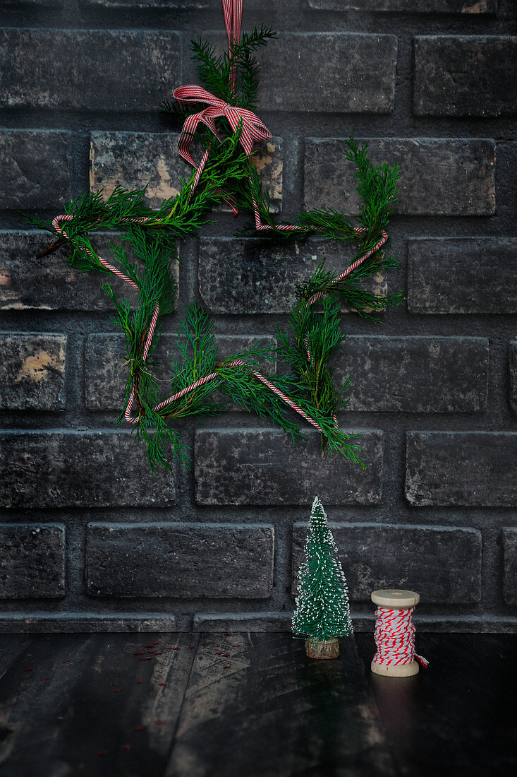 Christmas decoration on dark brick wall