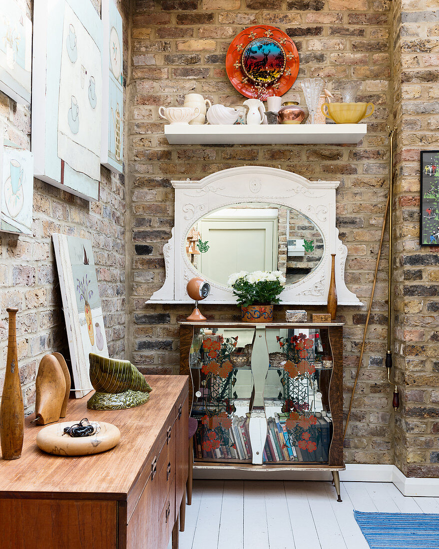 Vintage-style sideboard and chest of drawers against brick walls