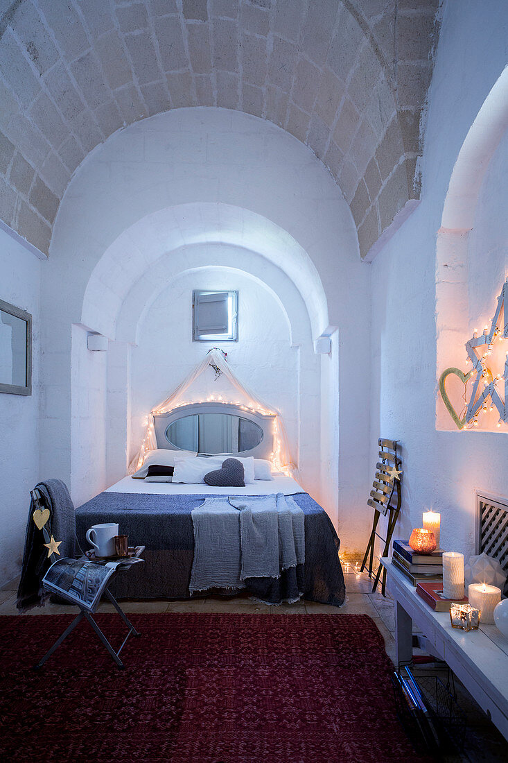 Bedroom with arched vaulted ceiling cosily decorated for Christmas